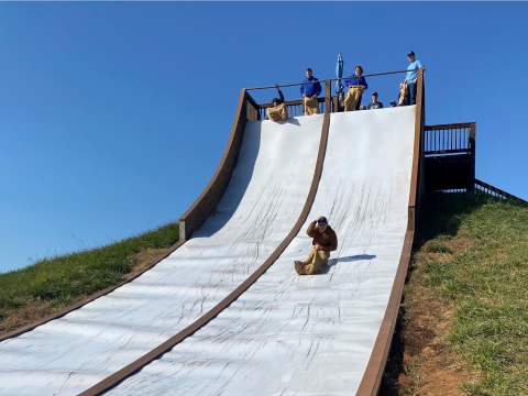 ABC In State trip 2022 student on potato sack slide